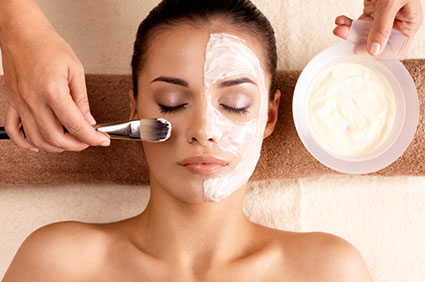 Young woman getting skin cleaning at beauty salon (shallow dof)